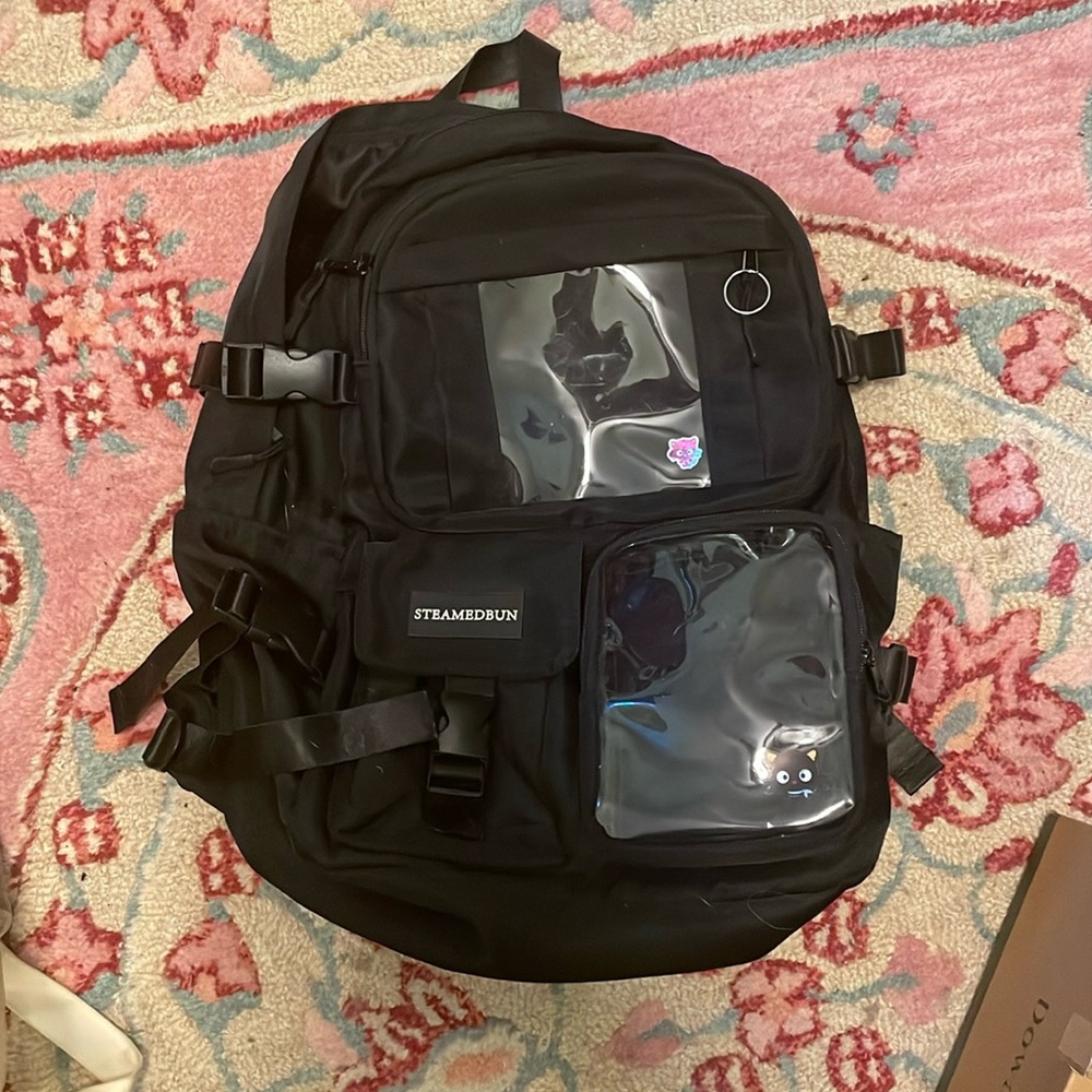 Black backpack with pin pockets
